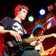 Illustration for article titled Bassist Has Little Riff Ready To Go In Case Frontman Goes Around Introducing Everyone